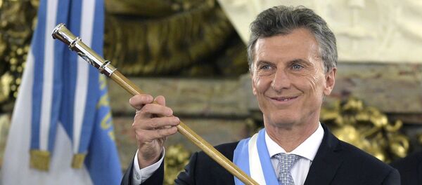 Argentine President Mauricio Macri, already wearing the presidential sash and staff, poses during his inauguration at the Casa Rosada government palace in Buenos Aires on December 10, 2015 Argentine President Mauricio Macri, already wearing the presidential sash and staff, poses during his inauguration at the Casa Rosada government palace in Buenos Aires on December 10, 2015 - Sputnik International