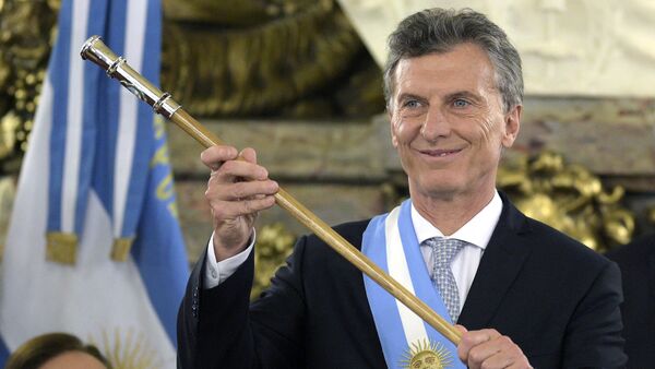 Argentine President Mauricio Macri, already wearing the presidential sash and staff, poses during his inauguration at the Casa Rosada government palace in Buenos Aires on December 10, 2015 - Sputnik International