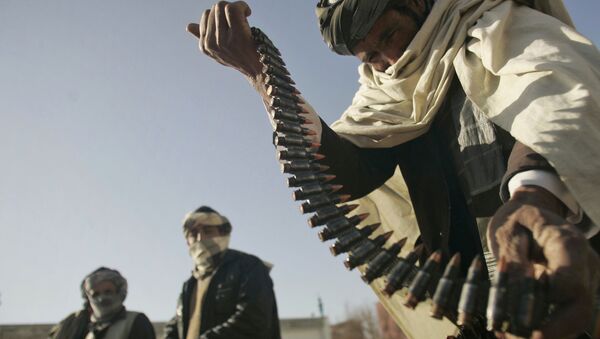 FILE - In this Dec. 28, 2011 file photo, a former Taliban fighter places a range of bullets before surrendering it to Afghan authorities, as part of a peace-reconciliation program in Herat, west of Kabul, Afghanistan - Sputnik International