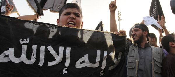 In this Friday, Sept. 14, 2012 file photo, Libyan followers of Ansar al-Shariah Brigades chant anti-U.S. slogans during a protest in front of the Tibesti Hotel, in Benghazi, Libya, as part of widespread anger across the Muslim world about a film ridiculing Islam's Prophet Muhammad In this Friday, Sept. 14, 2012 file photo, Libyan followers of Ansar al-Shariah Brigades chant anti-U.S. slogans during a protest in front of the Tibesti Hotel, in Benghazi, Libya, as part of widespread anger across the Muslim world about a film ridiculing Islam's Prophet Muhammad - Sputnik International