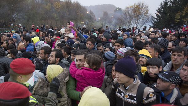 A file photo of migrants cue to enter Austria in Sentilj, Slovenia, Thursday, Oct. 29, 2015. - Sputnik International