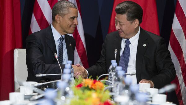 U.S. President Barack Obama, left, shakes hands with Chinese President Xi Jinping during their meeting held on the sidelines of the COP21, United Nations Climate Change Conference, in Le Bourget, outside Paris, Monday, Nov. 30, 2015 - Sputnik International