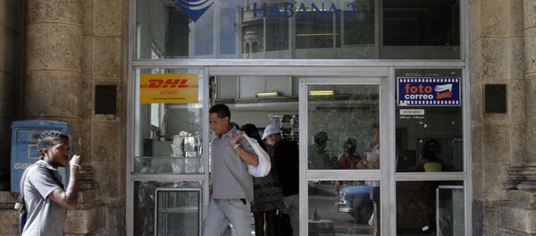 A man leaves a postal office in Havana, Cuba - Sputnik International