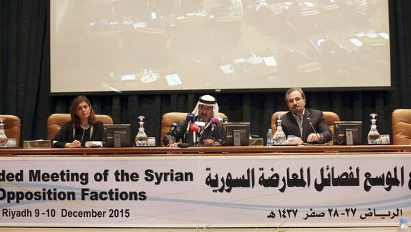 In this Thursday, Dec, 10, 2015 photo Abdulaziz bin Saqr, center, Chairman of the Gulf Research Council, speaks as Louay Safi, right, spokesperson for the Syrian National Coalition, and Hind Kabawat, left, a member of the elected committee that will negotiate with the Syrian regime, listen during a press conference after a three-day meeting of Syrian opposition groups in Riyadh, Saudi Arabia - Sputnik International