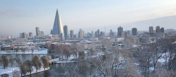 The 105-story pyramid-shaped Ryugyong Hotel towers over residential apartments and snow covered trees and fields on Thursday Dec. 3, 2015, in Pyongyang, North Korea where the winter season has started The 105-story pyramid-shaped Ryugyong Hotel towers over residential apartments and snow covered trees and fields on Thursday Dec. 3, 2015, in Pyongyang, North Korea where the winter season has started - Sputnik International