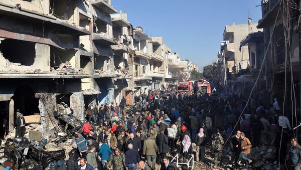Syrians gather at the site of a car bomb explosion in al-Zahra neighborhood in Homs on December 12, 2015 - Sputnik International