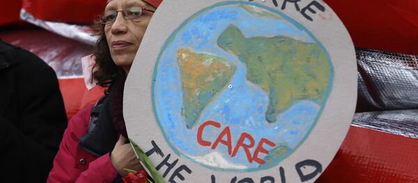 A climate activist demonstrates in Paris, Saturday, Dec.12, 2015 during the COP21, the United Nations Climate Change Conference. - Sputnik International