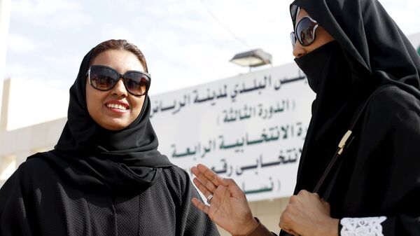 Saudi women leave a polling station after casting their votes during municipal elections, in Riyadh, Saudi Arabia December 12, 2015 - Sputnik International