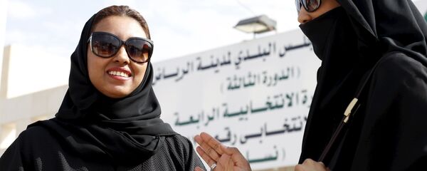 Saudi women leave a polling station after casting their votes during municipal elections, in Riyadh, Saudi Arabia December 12, 2015 - Sputnik International