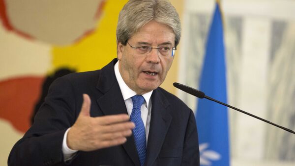 Italian Foreign Minister Paolo Gentiloni speaks during a joint press conference with US Secretary of State John Kerry and Special Representative of the UN Secretary-General for Libya Martin Kobler, at the end of a meeting on Libya at the Italian Foreign Ministry headquarters in Rome, Sunday, Dec. 13, 2015. - Sputnik International