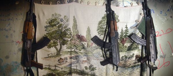 AK-47 machine guns hang in a shelter for Syrian rebels in the Salaheddine district of the northern Syrian city of Aleppo - Sputnik International