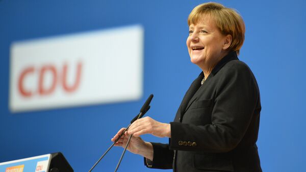 German Chancellor Angela Merkel speaks during a party convention of the Christian Democrats (CDU) in Karlsruhe, Germany, Monday, Dec. 14, 2015. - Sputnik International