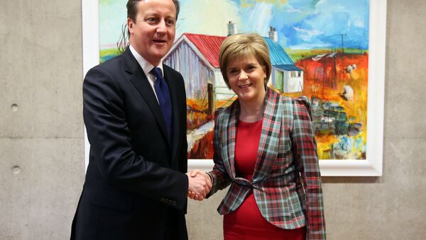 Britain's Prime Minister David Cameron is greeted by Scotland's First Minister Nicola Sturgeon at her office at the Scottish Parliament, Edinburgh, Scotland, Thursday Jan. 22, 2015. - Sputnik International