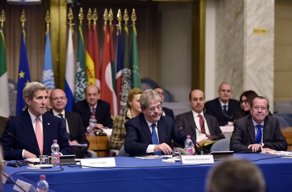 US Secretary of State John Kerry, left, and Italy's Foreign Minister Paolo Gentiloni, center, and UN special envoy for Libya Martin Kobler, right, take part in an international conference on Libya at the Ministry of Foreign Affairs in Rome Sunday, Dec. 13, 2015. US Secretary of State John Kerry, left, and Italy's Foreign Minister Paolo Gentiloni, center, and UN special envoy for Libya Martin Kobler, right, take part in an international conference on Libya at the Ministry of Foreign Affairs in Rome Sunday, Dec. 13, 2015. - Sputnik International