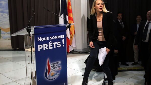 Far right National Front party regional leader for southeastern France Marion Marechal-Le Pen arrives to deliver her speech after the second round of the regional elections in Marseille, southern France, Sunday, Dec. 13, 2015. - Sputnik International