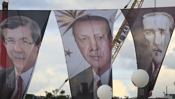 Banners from left to right show Turkish Prime Minister Ahmet Davutoglu, also leader of the Justice and Development Party (AKP); Turkey's current President Recep Tayyip Erdogan' and Turkish Republic founder Mustafa Kemal Ataturk - Sputnik International