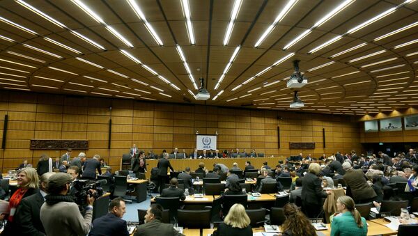 Delegates wait for the start of the board of governors meeting of the International Atomic Energy Agency, IAEA, at the International Center in Vienna, Austria, Tuesday, Dec, 15, 2015. - Sputnik International