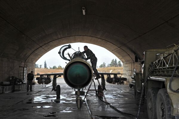MiG-21 aircraft of the Syrian Air Force gets ready for a mission at the Hama airbase near the city of Hama, Syria's Hama Province MiG-21 aircraft of the Syrian Air Force gets ready for a mission at the Hama airbase near the city of Hama, Syria's Hama Province - Sputnik International