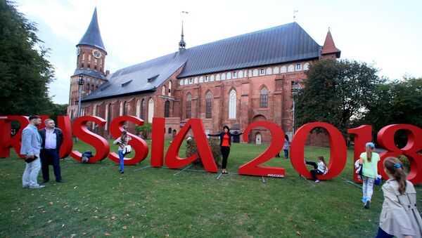 The official hashtag of the 2018 FIFA World Cup, which Russian will host, stands in front of the Konigsberg Cathedral, Kaliningrad - Sputnik International