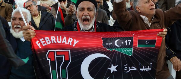 Libyan protesters shout slogans during a demonstration against a UN-sponsored agreement on forming a national unity government, on December 11, 2015 in the capital Tripoli. Libyan protesters shout slogans during a demonstration against a UN-sponsored agreement on forming a national unity government, on December 11, 2015 in the capital Tripoli. - Sputnik International