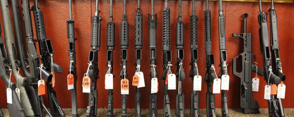 This photo taken on Thursday, June 27, 2013, shows a rack of rifles at Firing-Line gun store in Aurora, Colo. - Sputnik International