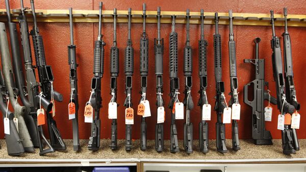 This photo taken on Thursday, June 27, 2013, shows a rack of rifles at Firing-Line gun store in Aurora, Colo. - Sputnik International