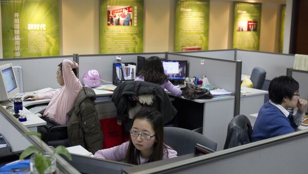Employees of Dagong Global Credit Rating Co. work at the company's office in Beijing, China - Sputnik International