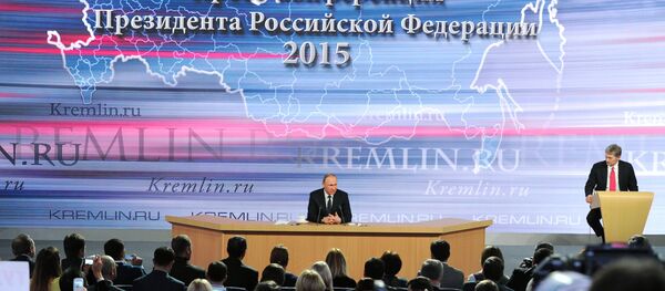 December 17, 2015. Russian President Vladimir Putin, center, at the 11th annual news conference at the World Trade Center on Krasnaya Presnya - Sputnik International