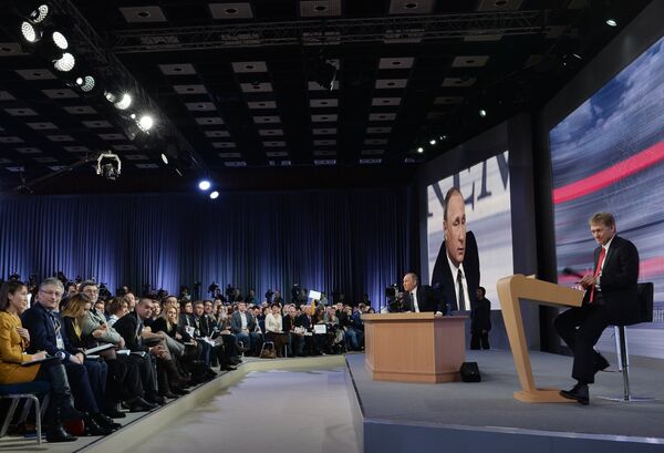 December 17, 2015. Russian President Vladimir Putin at the 11th annual news conference at the World Trade Center on Krasnaya Presnya. Right: Presidential Press Secretary Dmitry Peskov - Sputnik International