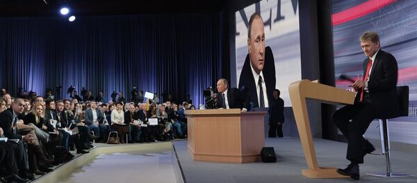 December 17, 2015. Russian President Vladimir Putin at the 11th annual news conference at the World Trade Center on Krasnaya Presnya. Right: Presidential Press Secretary Dmitry Peskov - Sputnik International