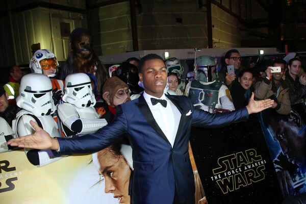 Star Wars newcomer John Boyega poses for photographers upon arrival at the European premiere of the film 'Star Wars: The Force Awakens' in London. - Sputnik International