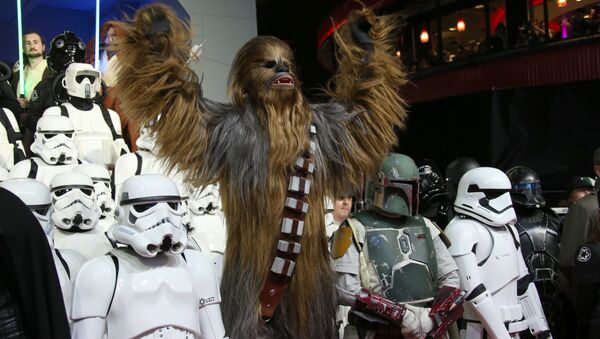 People dressed as characters from the film pose for photographers upon arrival at the European premiere of the film 'Star Wars: The Force Awakens ' in London. - Sputnik International