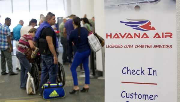 Travelers line up to check in for charter flights from Miami to Havana at Miami International Airport, Friday, Jan. 16, 2015 in Miami - Sputnik International