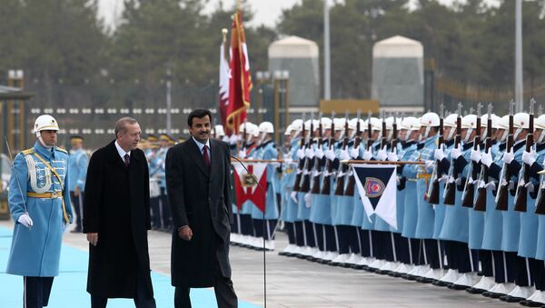 Turkish President Recep Tayyip Erdogan and Qatar's Emir Sheikh Tamim bin Hamad Al-Thani, right, inspect a military honour guard at the new presidential palace in Ankara, Turkey, Friday, Dec. 19, 2014. - Sputnik International