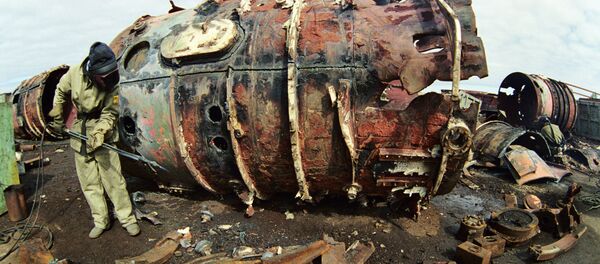A welder in protective suit cutting the body of a nuclear-powered submarine. File photo A welder in protective suit cutting the body of a nuclear-powered submarine. File photo - Sputnik International