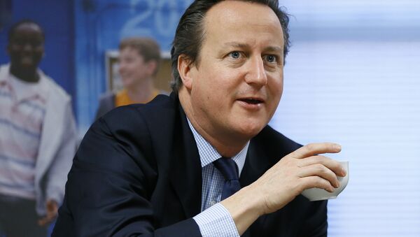 Britain's Prime Minister David Cameron takes a drink. - Sputnik International
