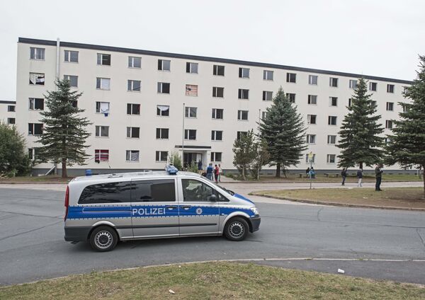 In this Thursday, Aug. 20, 2015 file photo, a police car patrols in front of the refugee home in Suhl, central Germany - Sputnik International