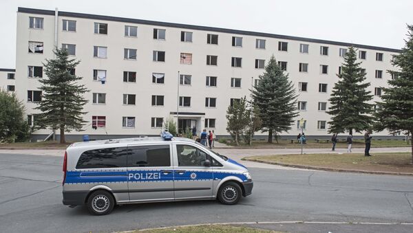 In this Thursday, Aug. 20, 2015 file photo, a police car patrols in front of the refugee home in Suhl, central Germany - Sputnik International