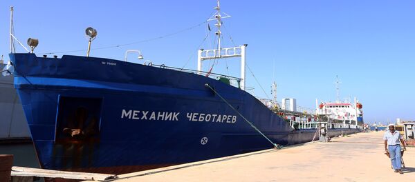 A picture taken on September 17, 2015 shows a Russian flagged oil tanker after it was caught in Libyan waters without permission and brought to Tripoli’s maritime base by Libyan coastal authorities for investigation as they believed the Russian crew were smuggling fuel from the port of Zuwarah, some 160 kilometres from the capital A picture taken on September 17, 2015 shows a Russian flagged oil tanker after it was caught in Libyan waters without permission and brought to Tripoli’s maritime base by Libyan coastal authorities for investigation as they believed the Russian crew were smuggling fuel from the port of Zuwarah, some 160 kilometres from the capital - Sputnik International