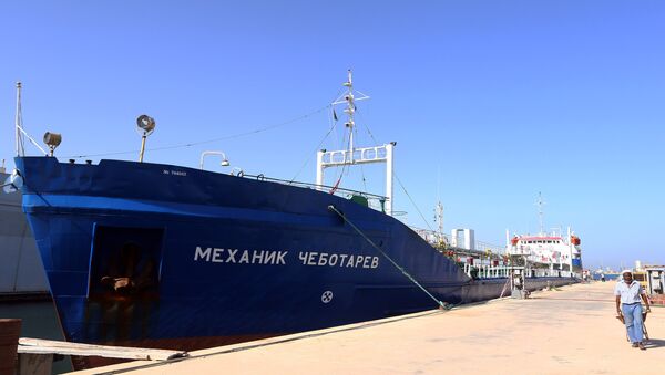 A picture taken on September 17, 2015 shows a Russian flagged oil tanker after it was caught in Libyan waters without permission and brought to Tripoli’s maritime base by Libyan coastal authorities for investigation as they believed the Russian crew were smuggling fuel from the port of Zuwarah, some 160 kilometres from the capital - Sputnik International