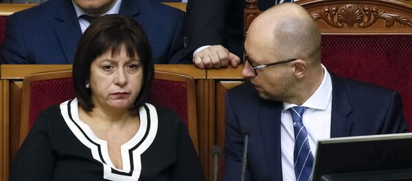 Ukraine's Prime Minister Arseny Yatseniuk (R) and Finance Minister Natalia Yaresko attend a session of parliament in Kiev, Ukraine, December 17, 2015 - Sputnik International