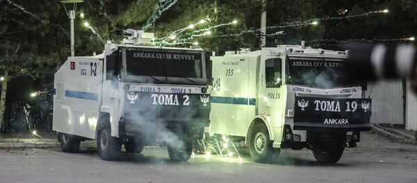 Demonstrators throw fireworks at anti-riot police during clashes outside the Middle Eastern Technical University (METU) in Ankara on December 17, 2015 - Sputnik International