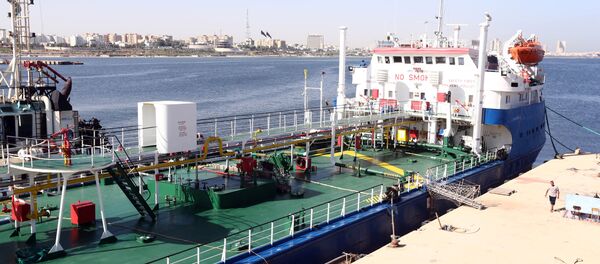 A picture taken on September 17, 2015 shows a Russian flagged oil tanker after it was caught in Libyan waters without permission and brought to Tripoli’s maritime base by Libyan coastal authorities for investigation as they believed the Russian crew were smuggling fuel from the port of Zuwarah, some 160 kilometres from the capital - Sputnik International