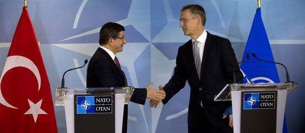 Turkish Prime Minister Ahmet Davutoglu shakes hands with NATO Secretary General Jens Stoltenberg after addressing a media conference at NATO headquarters in Brussels. Turkish Prime Minister Ahmet Davutoglu shakes hands with NATO Secretary General Jens Stoltenberg after addressing a media conference at NATO headquarters in Brussels. - Sputnik International