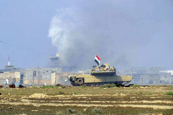 A national flag waves on an Iraqi Army Abrams tank as Iraqi forces supported by U.S.-led coalition airstrikes advance their position during clashes with Islamic State group in the western suburbs of Ramadi, Nov. 21, 2015 A national flag waves on an Iraqi Army Abrams tank as Iraqi forces supported by U.S.-led coalition airstrikes advance their position during clashes with Islamic State group in the western suburbs of Ramadi, Nov. 21, 2015 - Sputnik International