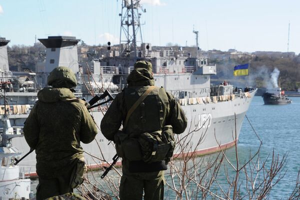 Russian forces patrol near the Ukrainian navy ship Slavutich in the harbor of the Ukrainian city of Sevastopol on March 5, 2014 Russian forces patrol near the Ukrainian navy ship Slavutich in the harbor of the Ukrainian city of Sevastopol on March 5, 2014 - Sputnik International
