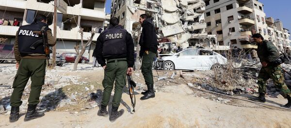 A general view shows Syrian police standing guard at the site of a reported Israeli air raid that killed a senior figure in the Lebanese Shiite militant group Hezbollah, Samir Kantar, in Jaramana, southeast of the Syrian capital Damascus A general view shows Syrian police standing guard at the site of a reported Israeli air raid that killed a senior figure in the Lebanese Shiite militant group Hezbollah, Samir Kantar, in Jaramana, southeast of the Syrian capital Damascus - Sputnik International
