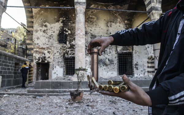 A boy shows bullets used during clashes between Kurdish fighters and Turkish special forces in the Sur district in Diyarbakir on December 11, 2015. A boy shows bullets used during clashes between Kurdish fighters and Turkish special forces in the Sur district in Diyarbakir on December 11, 2015. - Sputnik International