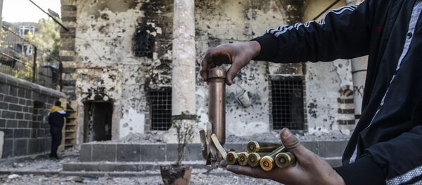 A boy shows bullets used during clashes between Kurdish fighters and Turkish special forces in the Sur district in Diyarbakir on December 11, 2015. A boy shows bullets used during clashes between Kurdish fighters and Turkish special forces in the Sur district in Diyarbakir on December 11, 2015. - Sputnik International