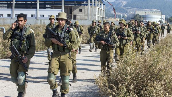 Israeli soldiers patrol the northern Israeli-Lebanon border - Sputnik International